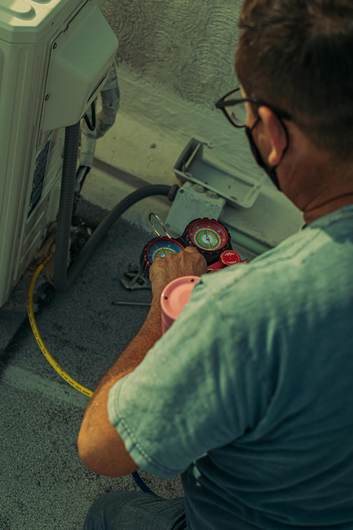 Air conditioning gauges being checked during commissioning